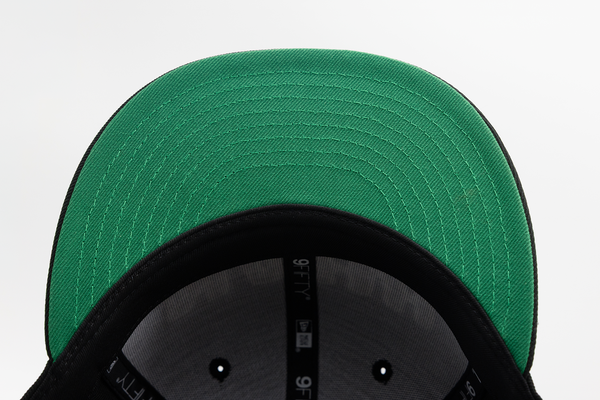 TEAMWORKS NAHH New Era 9FIFTY Snapback featuring the signature green undervisor.